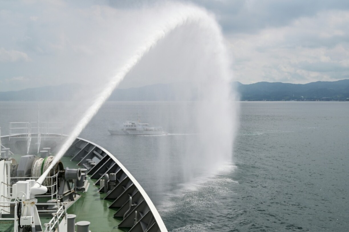 A water cannon is sprayed from the deck of the Japan Coast Guard ship Asanagi