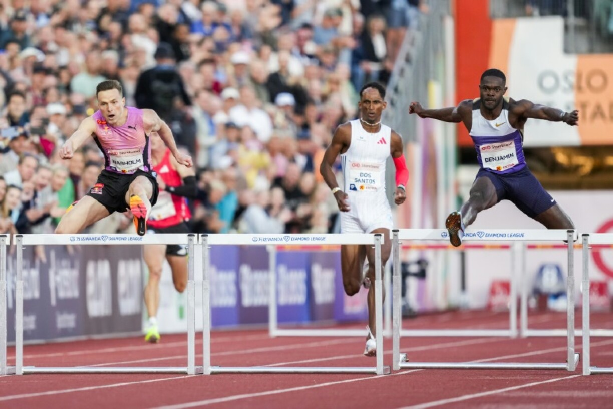 (From L) Norway's Karsten Warholm, Brazil's Alison Dos Santos and American Rai Benjamin compete in the men's 300m hurdles in Oslo
