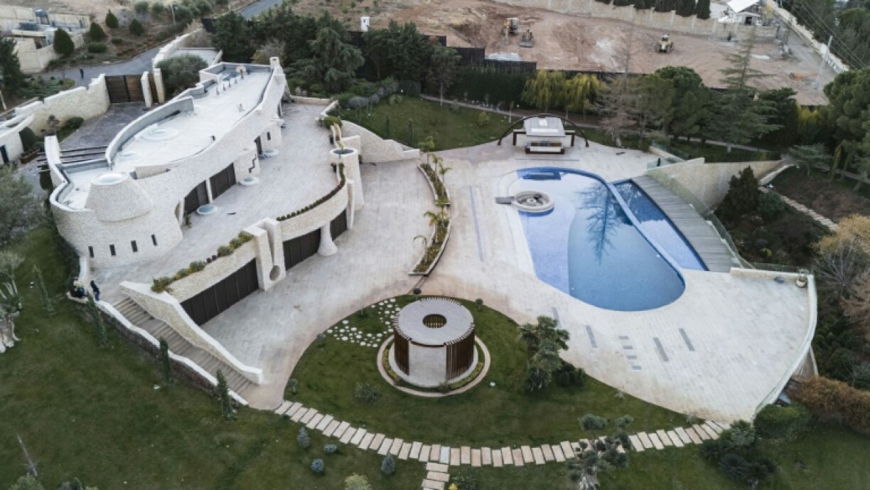 Ill-gotten gains: Maher al-Assad's villa is built into a hillside in a Damascus suburb