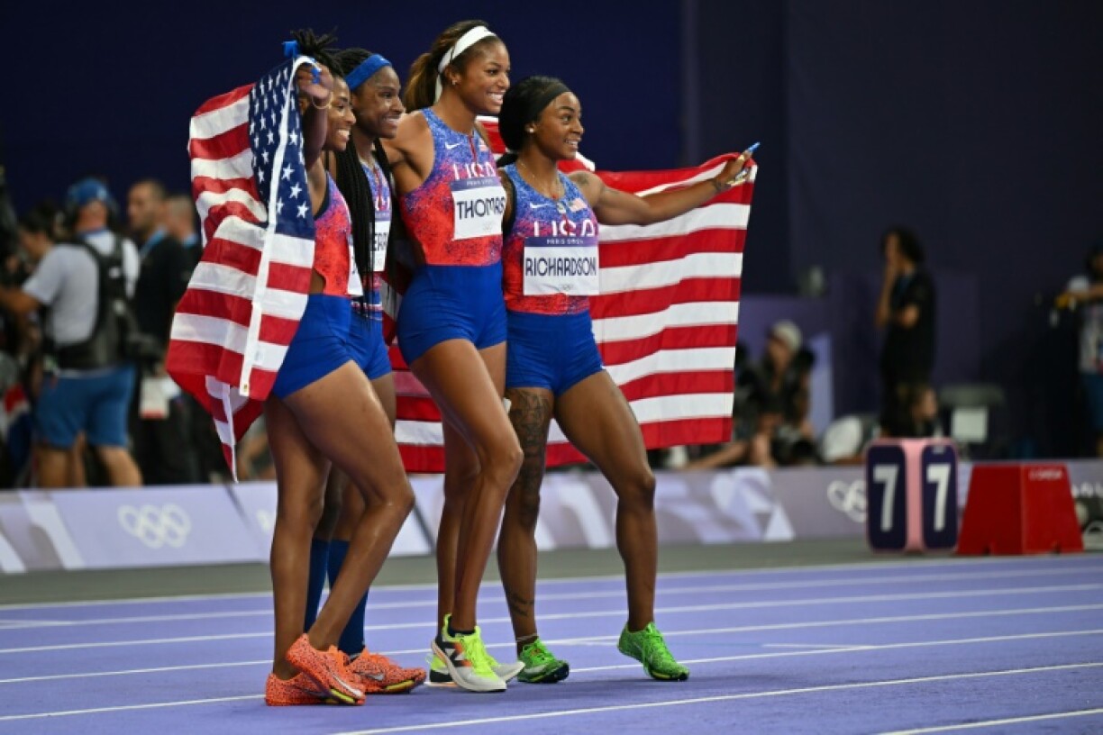 Gabrielle Thomas (2R) and Sha'Carri Richardson (R) celebrating 4x100m Olympic relay gold had disrupted family backgrounds but have turned out very differently