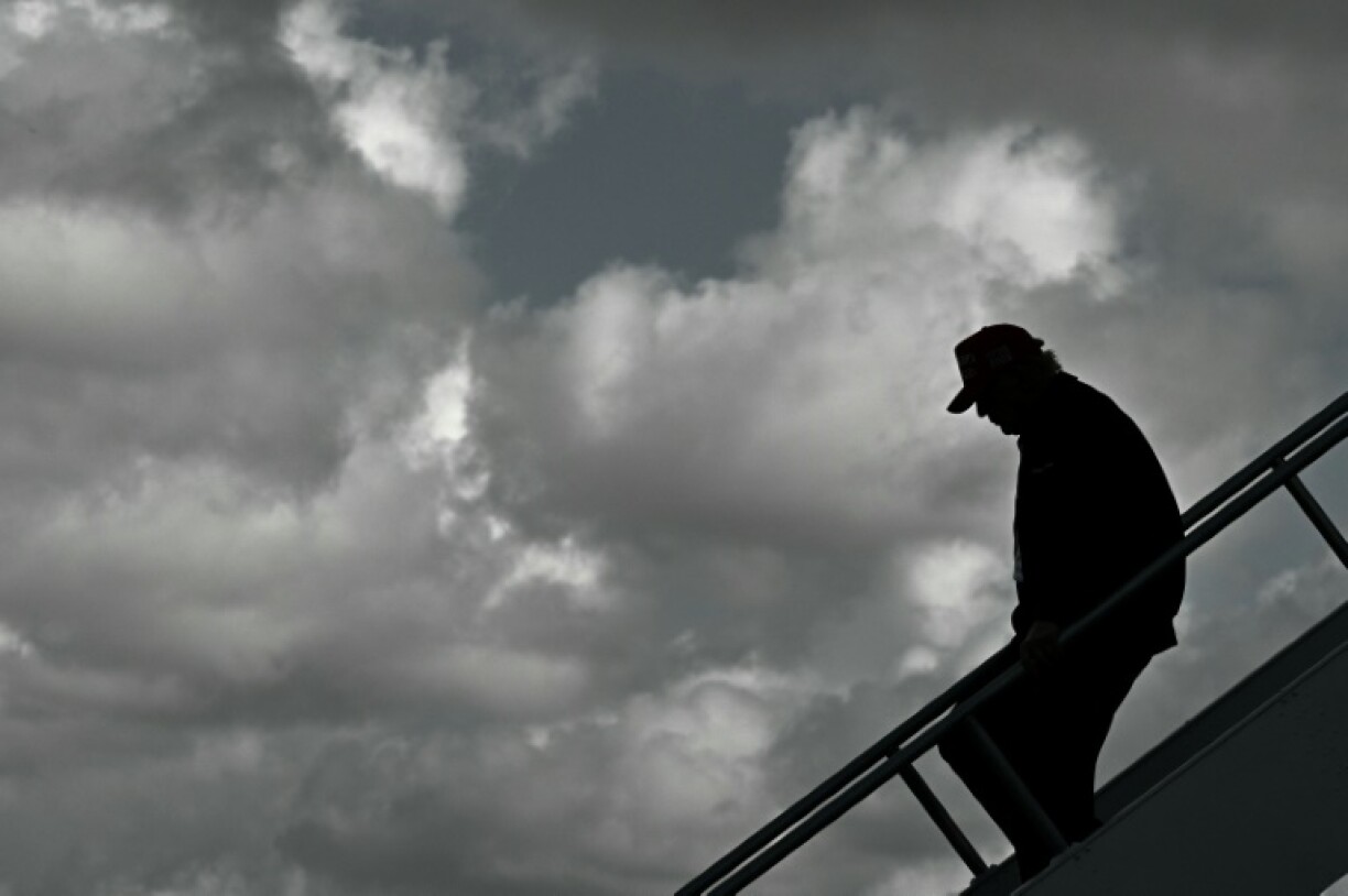 US President Donald Trump steps off Air Force One upon arrival at Miami International Airport in Miami, Florida on February 19, 2025