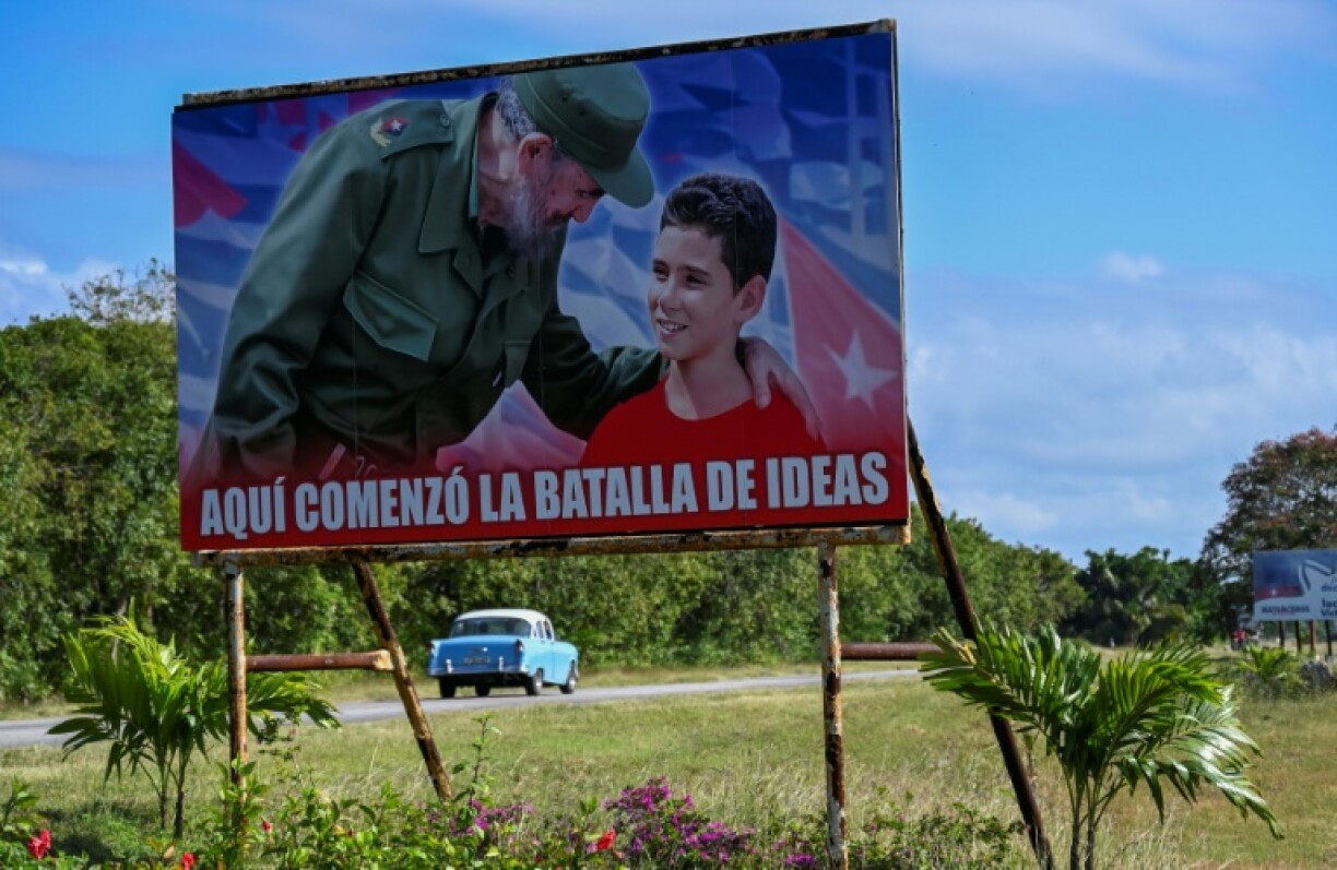 Poster of the late Cuban leader Fidel Castro and Elian Gonzalez is seen on a road in Cardenas
