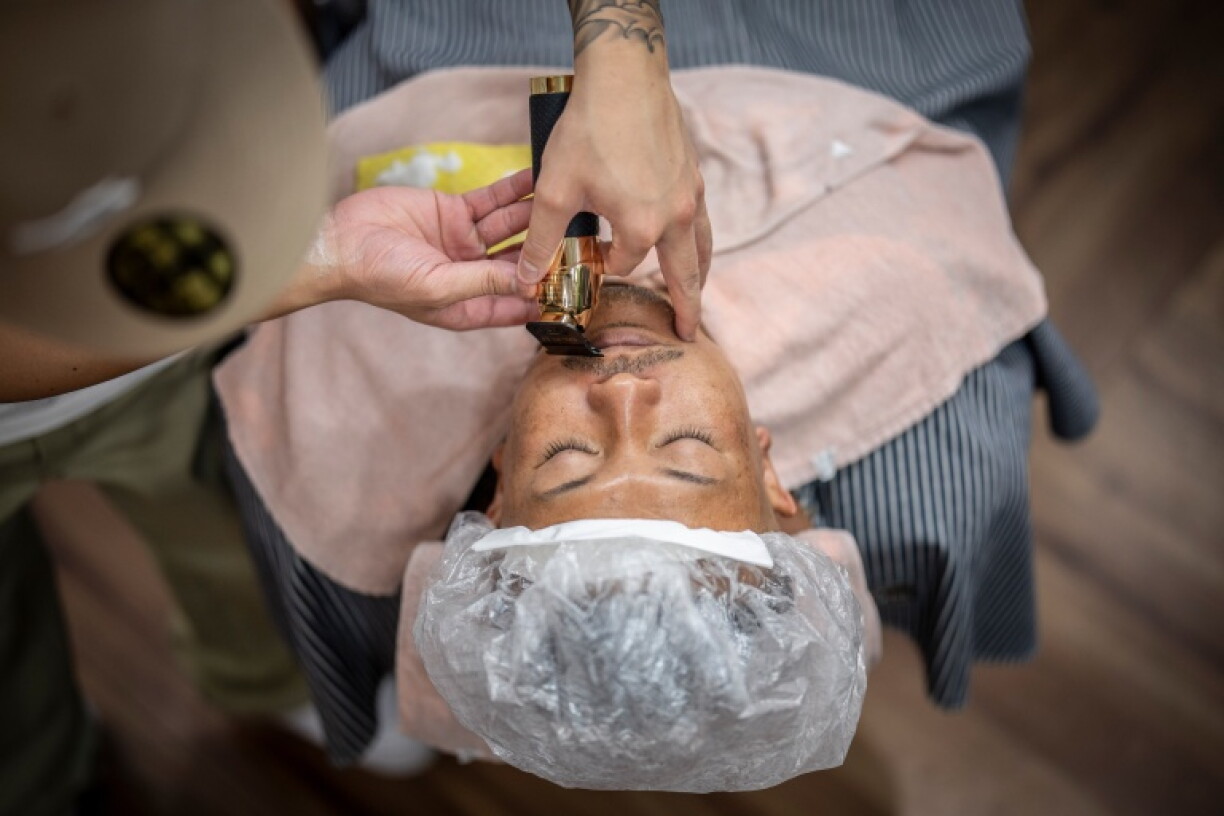Tekisasu says yakuza pay their barbers in cash, as Japan's strict anti-mafia laws prohibit them from having credit cards