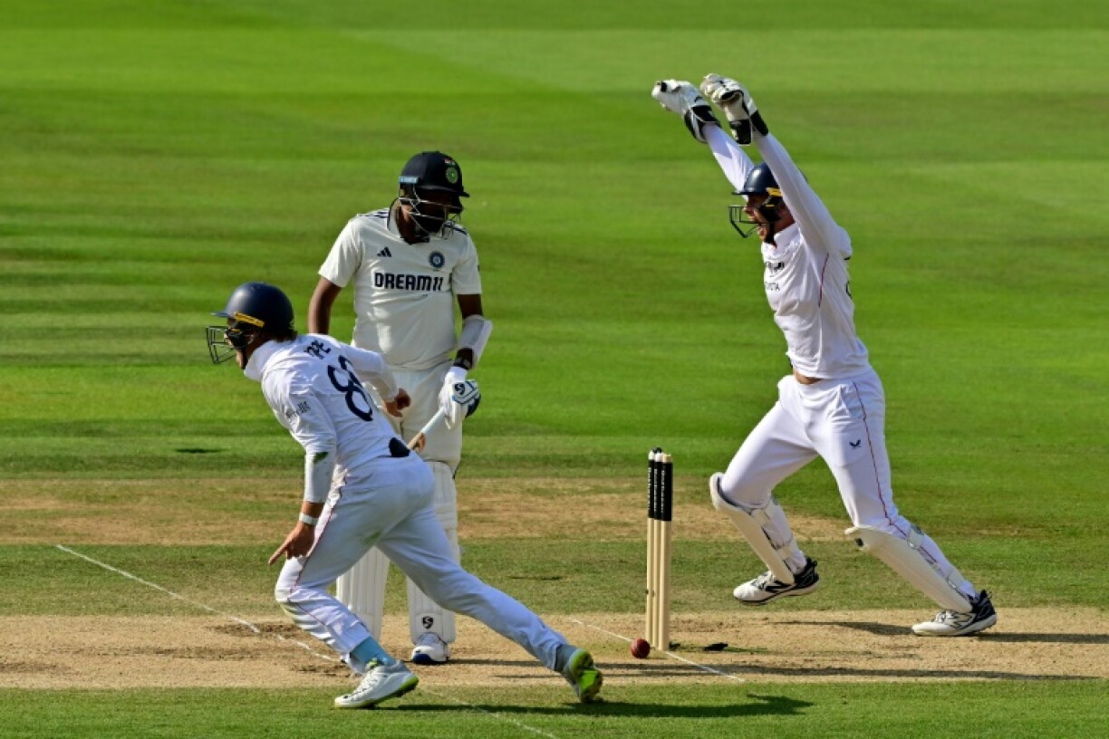 India's Mohammed Siraj looks back to see his bail dislodged as the England fielders celebrate their 22-run win in the third Test at Lord's