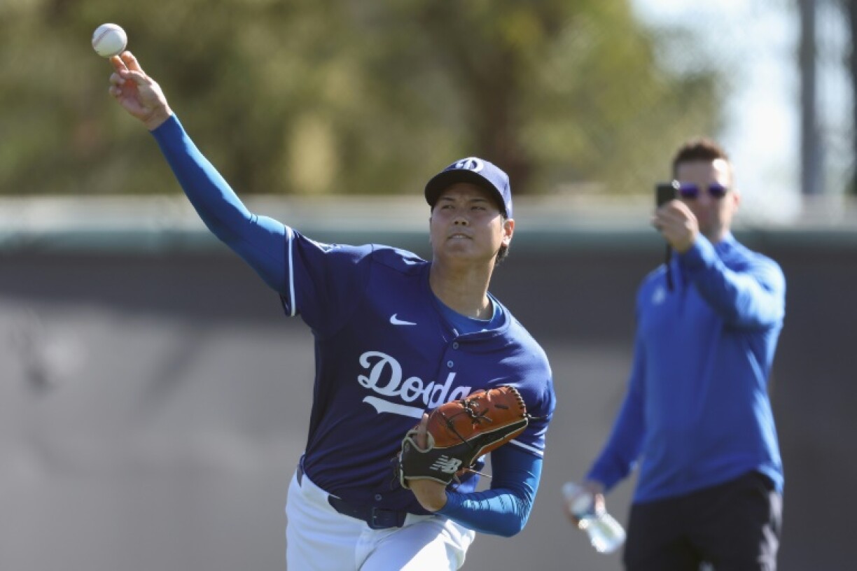Japanese two-way star Shohei Ohtani warms up during a workout at Los Angeles Dodgers spring training
