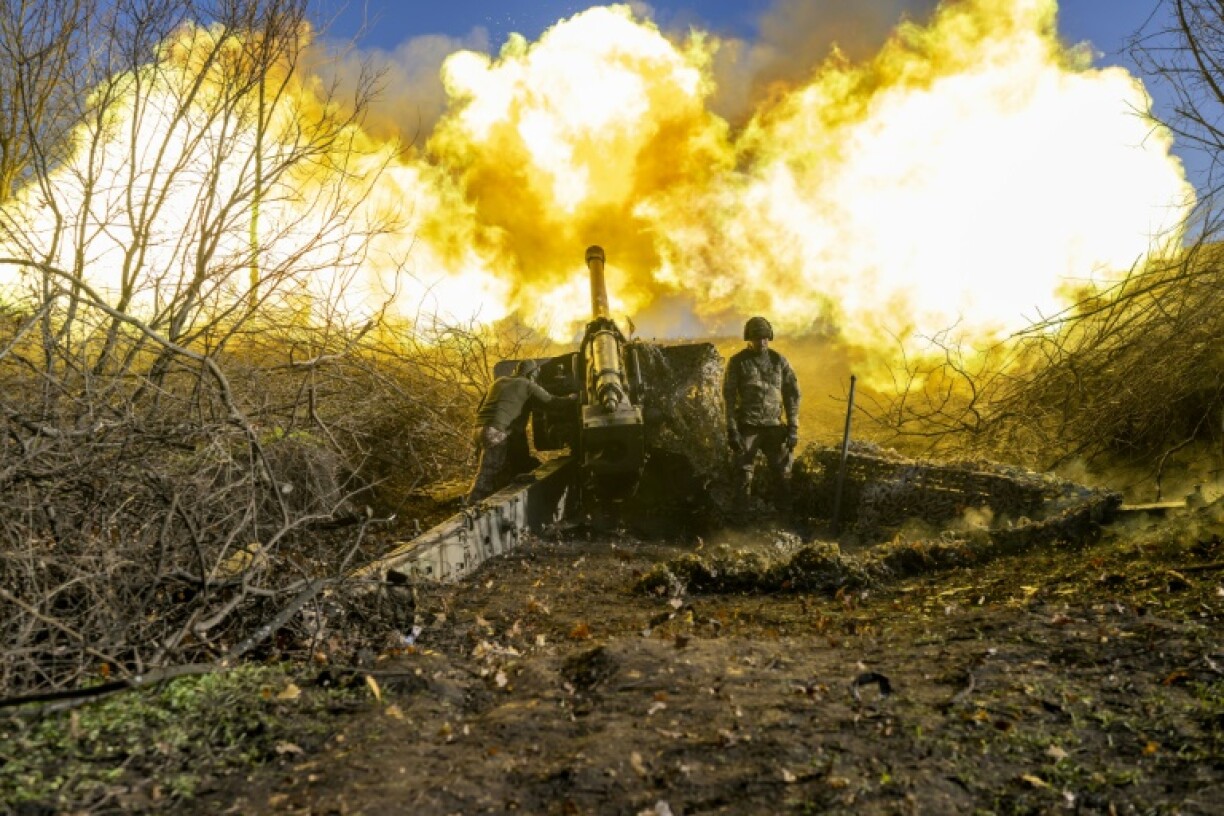 Three years of war -- A Ukrainian soldier of an artillery unit fires towards Russian positions in 2022