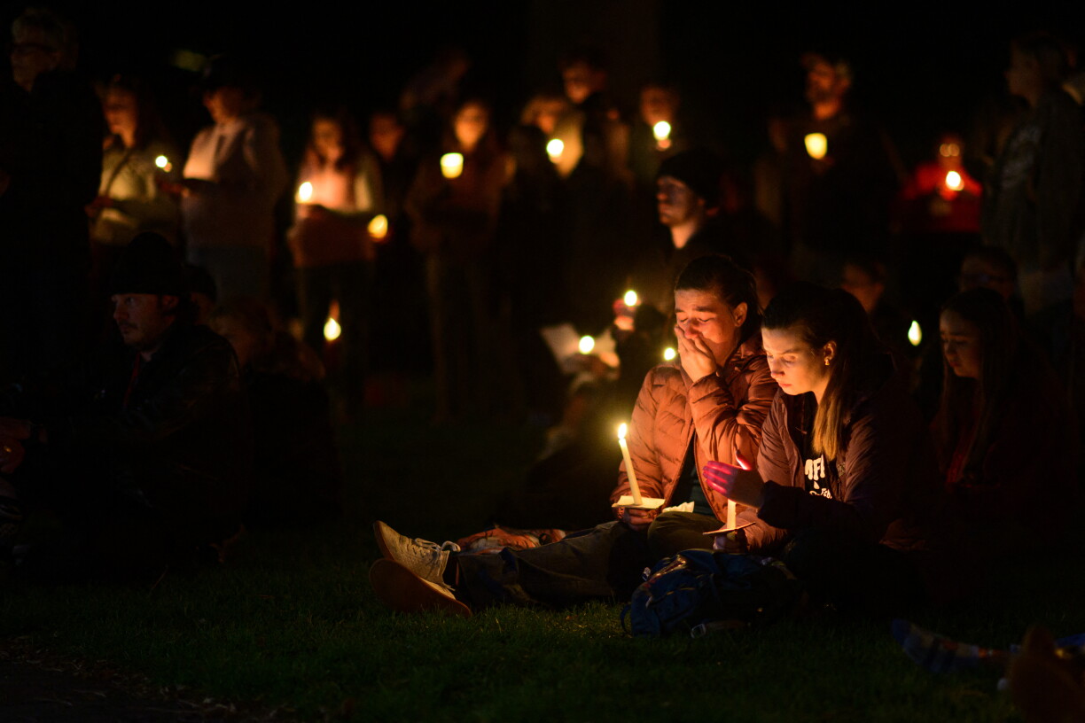 BEND, OREGON - OCTOBER 15: Community members grieve during a candlelight vigil at Drake Park on October 15, 2026 in Bend, Oregon. At least four victims were reportedly killed at Silver Rail Elementary School in a mass shooting earlier today, the alleged gunman is also dead. Mathieu Lewis-Rolland/Getty Images/AFP (Photo by Mathieu Lewis-Rolland / GETTY IMAGES NORTH AMERICA / Getty Images via AFP)