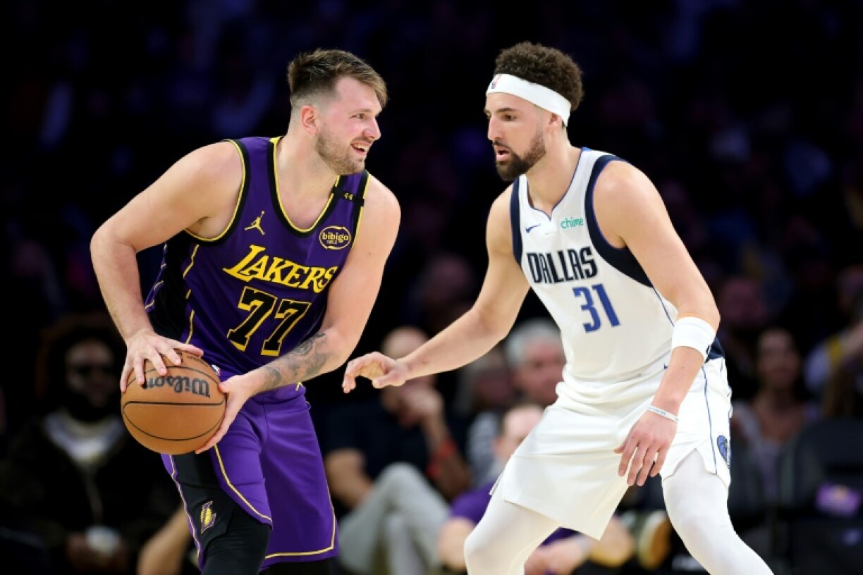 Los Angeles Lakers guard Luka Doncic looks to pass past Klay Thompson as he faced his old team the Dallas Mavericks for the first time since his shock trade.