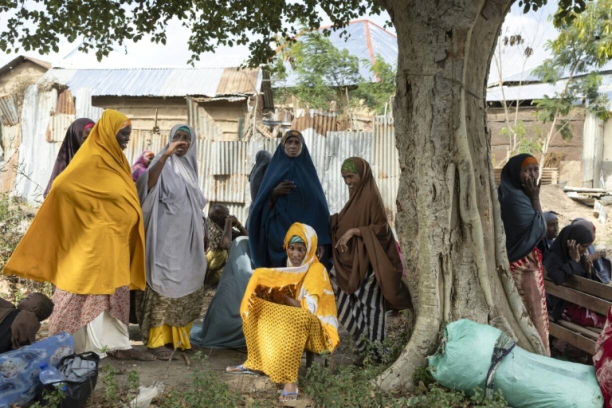 Villagers gather for an address by senior officers of the Somalian army