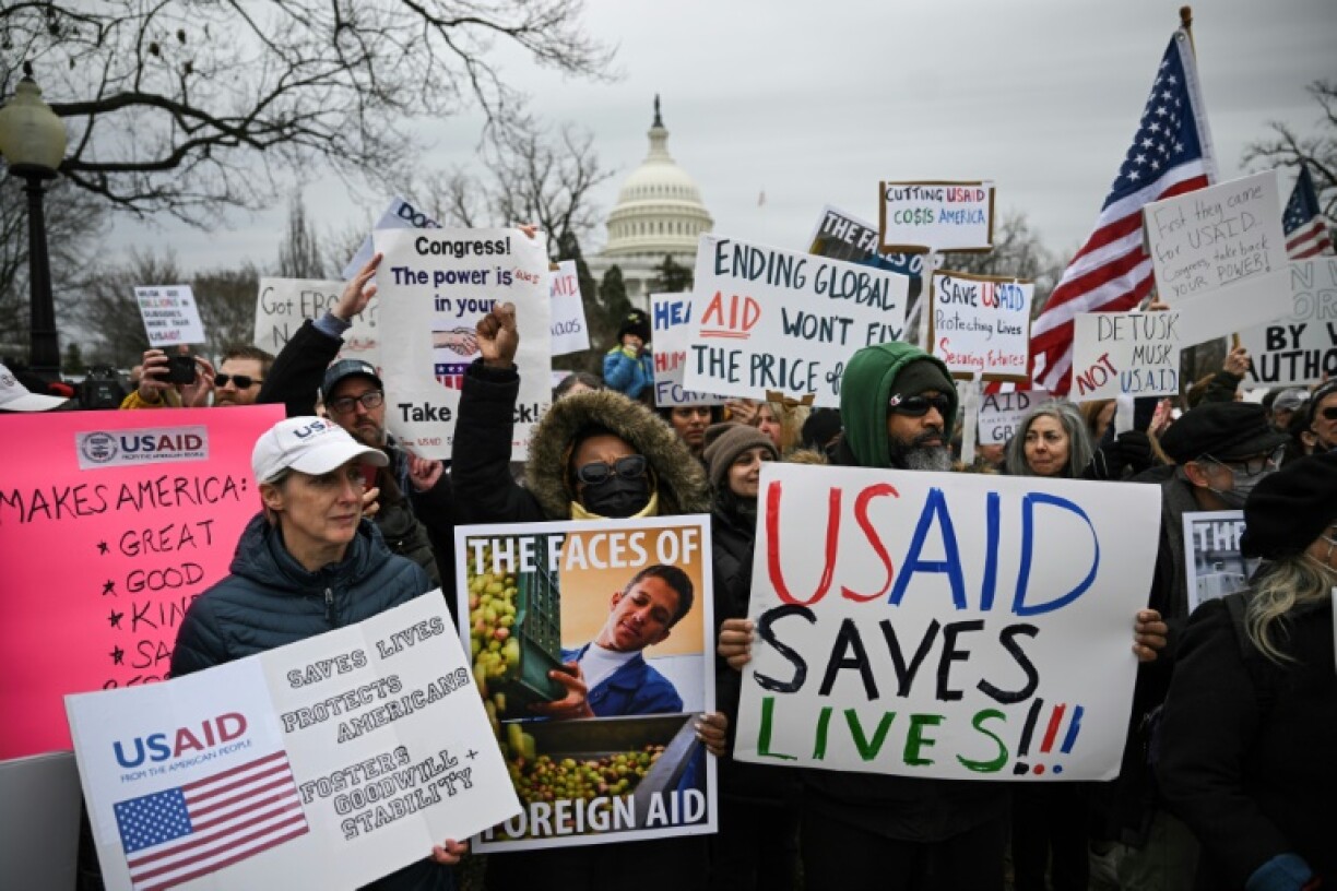 People protest on February 5, 2025 in Washington against President Donald Trump's administration's efforts to shutter the US Agency for International Development and lay off thousands of federal employees