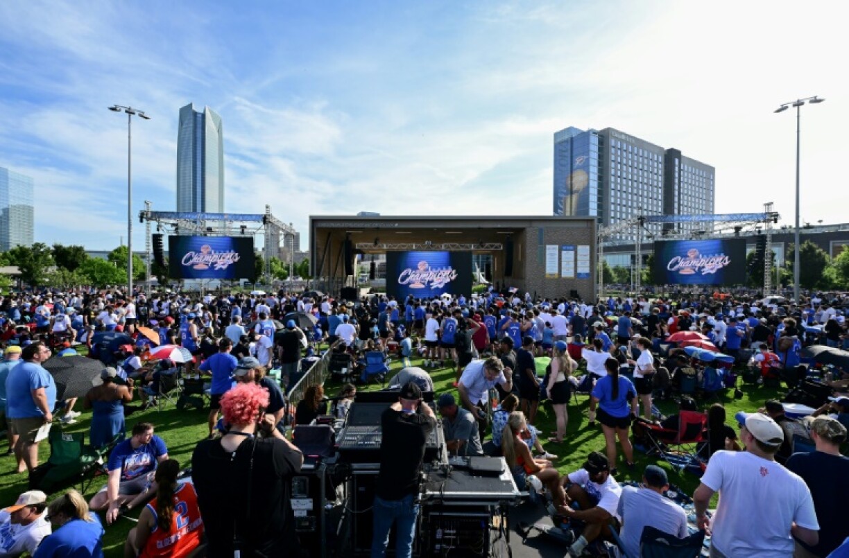 Oklahoma City Thunder fans celebrate at a parade and rally to pay tribute to the team's winning its first NBA title
