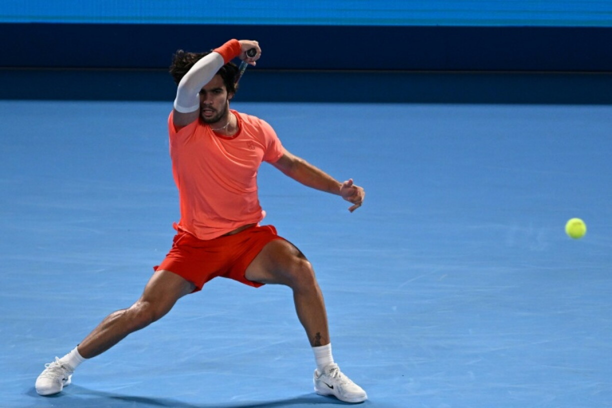 Spain's Carlos Alcaraz plays a shot to USA's Alex Michelsen during their men's singles tennis match at the ATP Tour Japan Open Tennis Championships at the Ariake Tennis Forest Park in Tokyo on October 1, 2026.