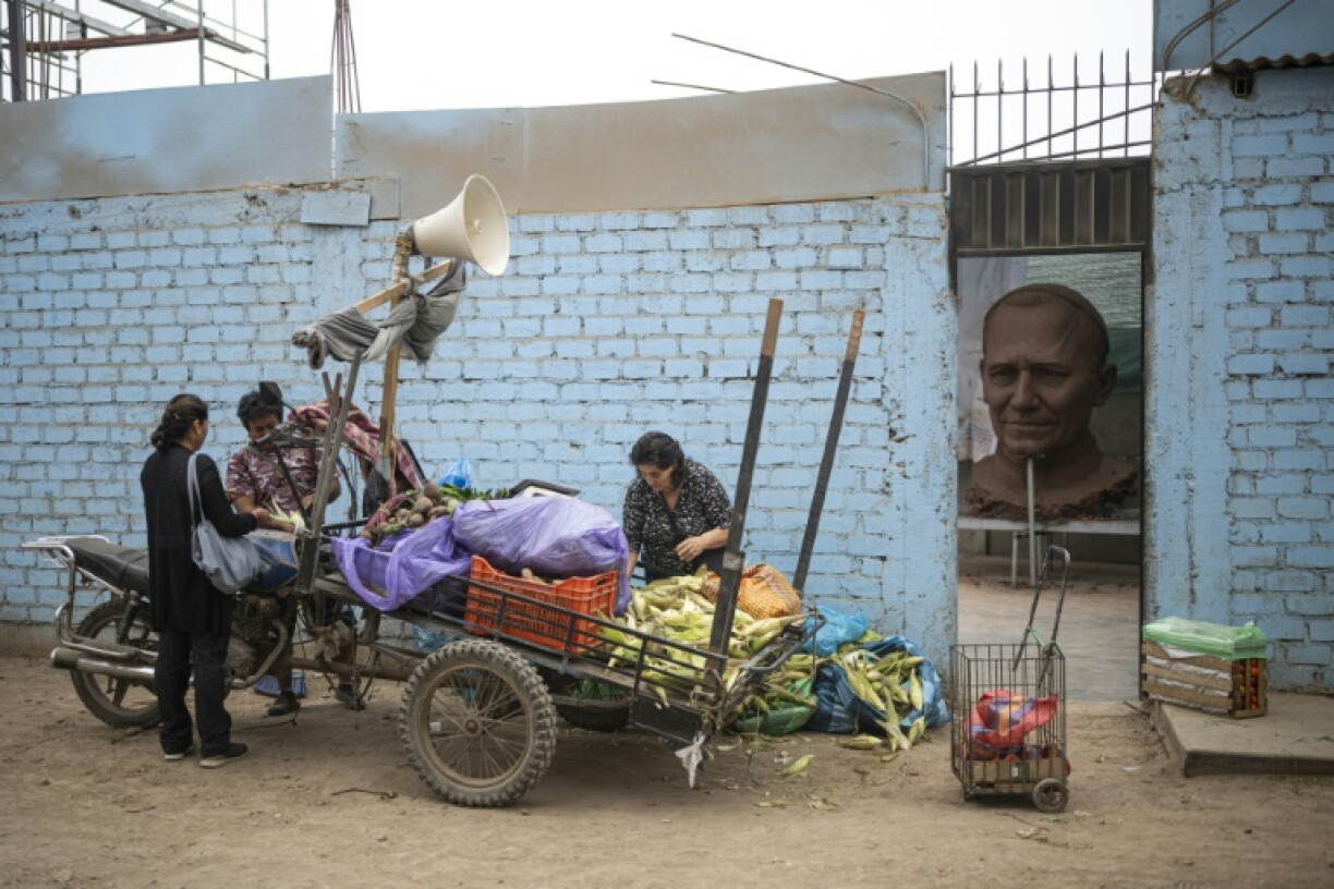 A total of eight people are working on the giant replica of the pope