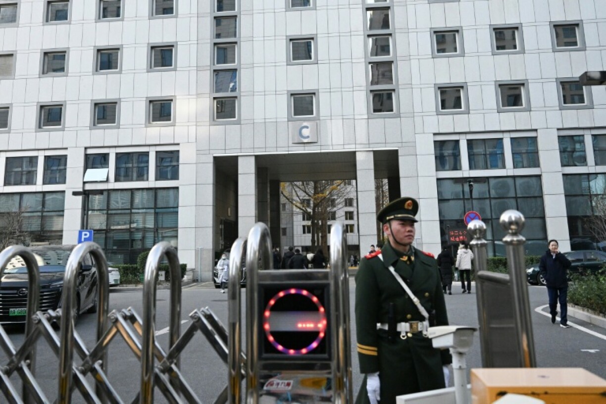 A paramilitary police officer stands guard outside a building of the foreign ministry in Beijing