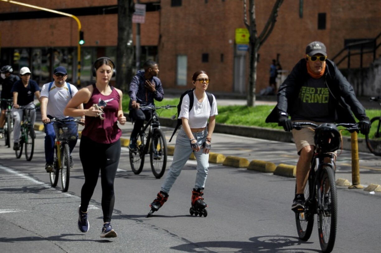 An estimated 1.7 million Bogotanos walk, cycle, jog, rollerblade, scoot, ride unicycles, push buggies through 128 kilometers (79 miles) of car-free streets each Sunday