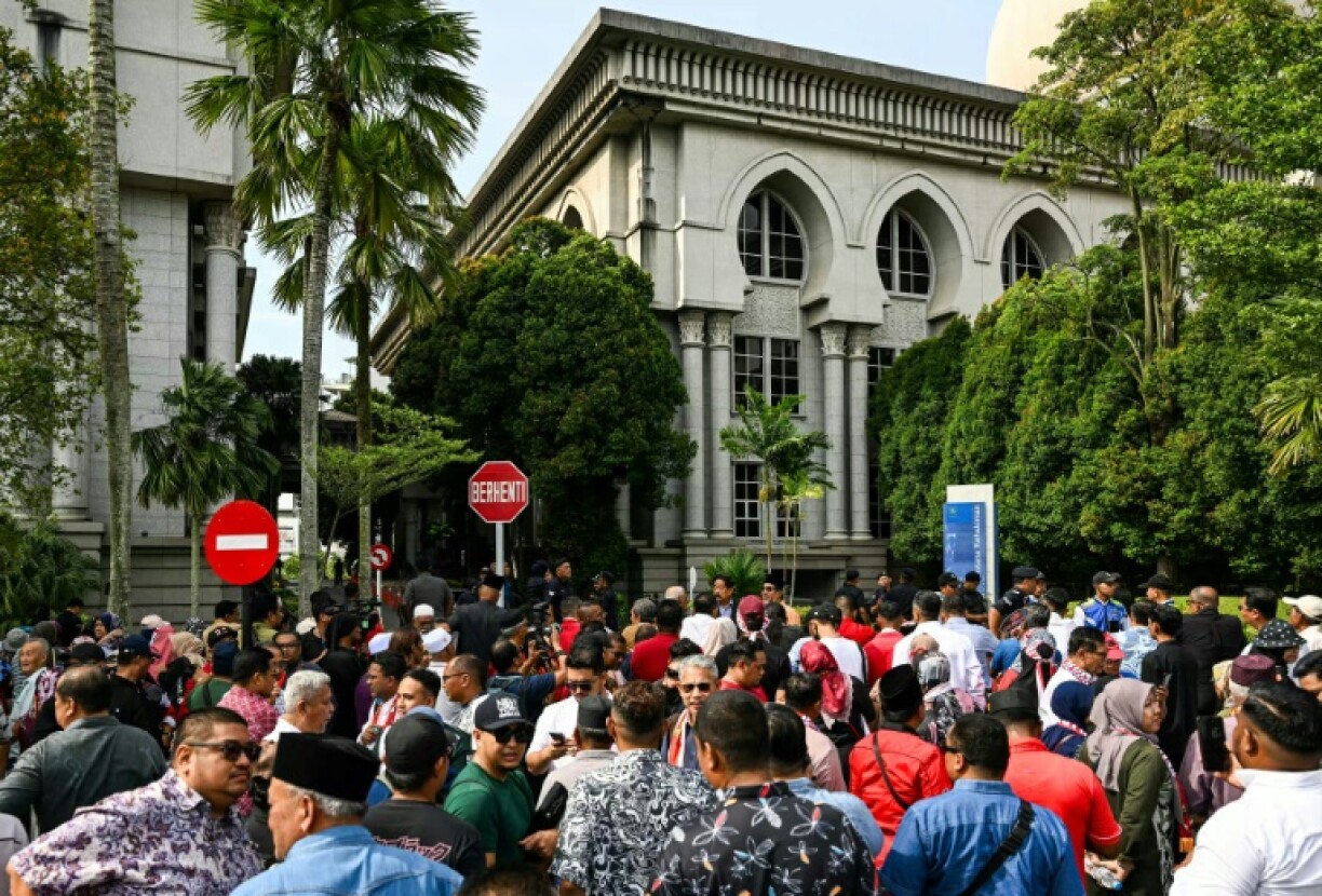 Supporters of Malaysia's former prime minister Najib Razak gather for his appeal hearing outside the Malaysian Court of Appeal