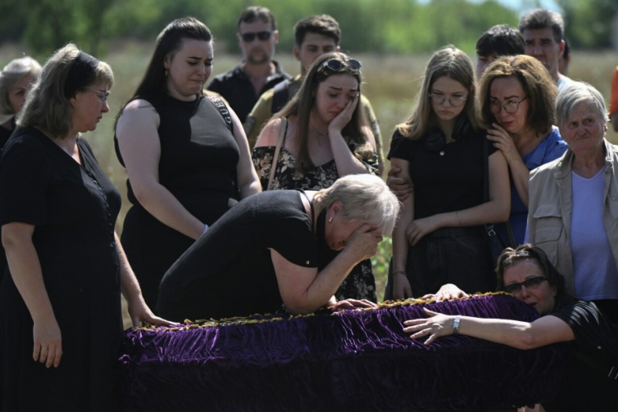 The funeral for Mykyta and Sofia Lamekhov and their son Lev in Sloviansk, Ukraine, on August 5