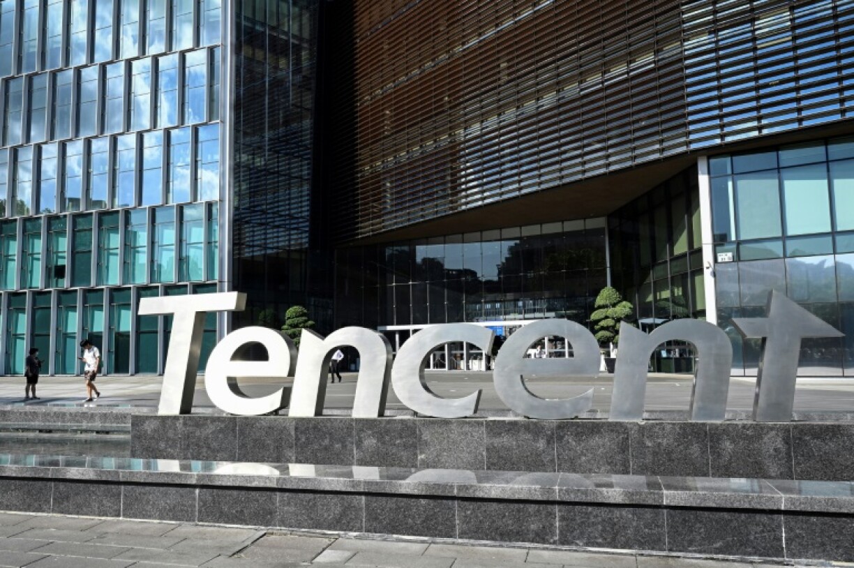 People walking past the Tencent headquarters in Shenzhen in China's southern Guangdong province
