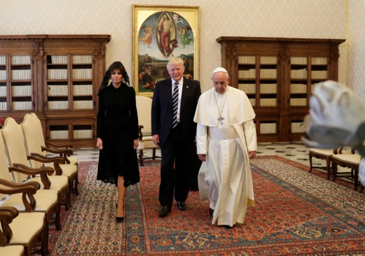 Pope Francis walks along with US President Donald Trump and US First Lady Melania Trump at the Vatican in May 2017
