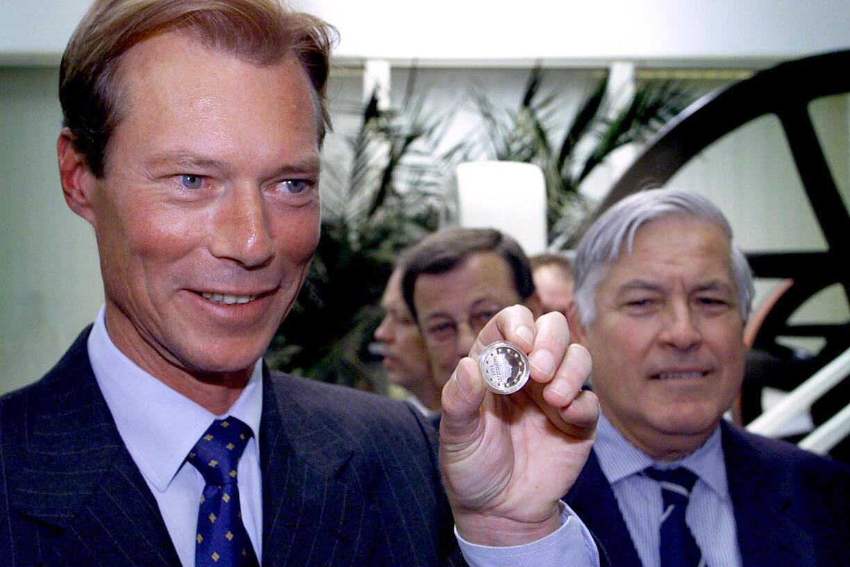 Grand Duke Henri presenting an example of the first Luxembourg euro coins minted at a ceremoy in the Royal Dutch Mint in Utrecht on 27 June 2000.