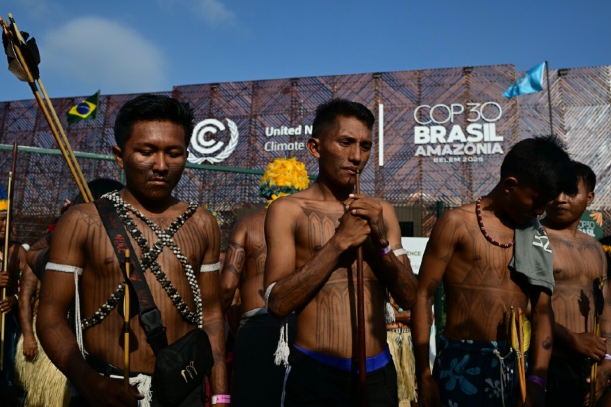 Members of the Indigenous movement Munduruku Ipereg Ayu hold a protest outside the United Nations climate summit venue in Belem, Brazil