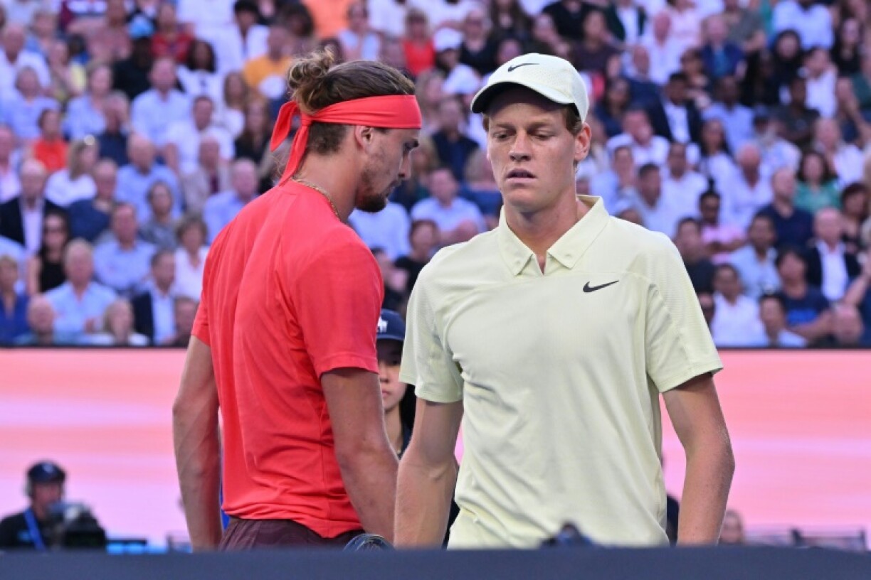 Italy's Jannik Sinner and Germany's Alexander Zverev walk between games during their men's singles final