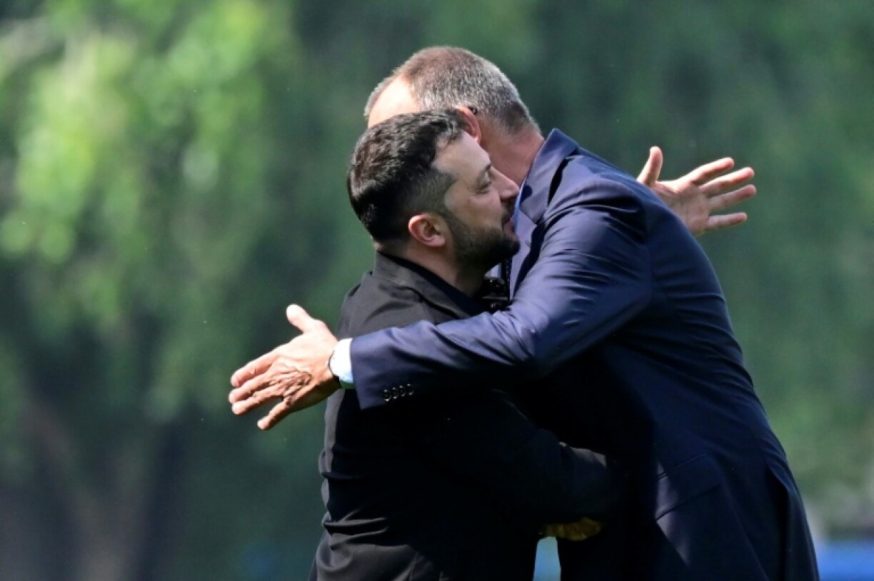 Ukrainian President Volodymyr Zelensky is welcomed by German Chancellor Friedrich Merz at the Chancellery in Berlin