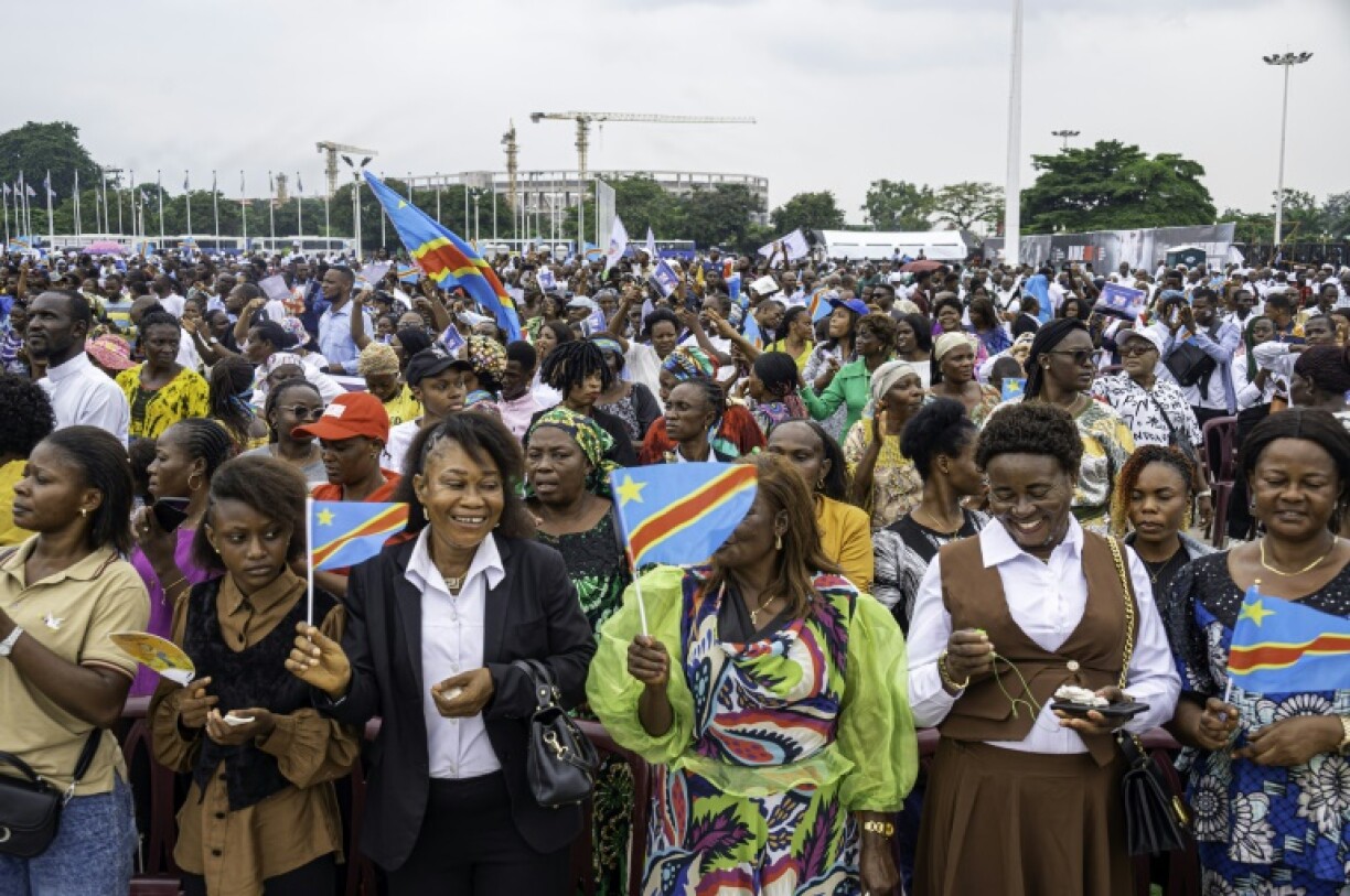 Members of the public in the capital Kinshasa praying for an end to the fighting in the east