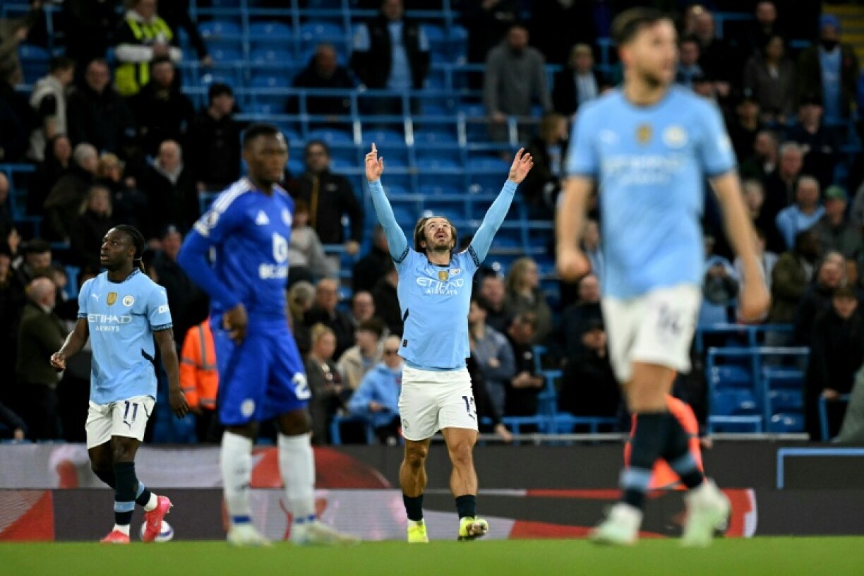 Early opener: Manchester City midfielder Jack Grealish celebrates scoring a second-minute goal against Leicester