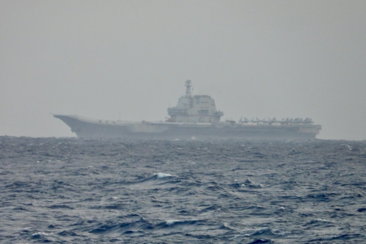 China said that two of its aircraft carrier groups had returned from carrying out combat drills in the western Pacific Ocean
