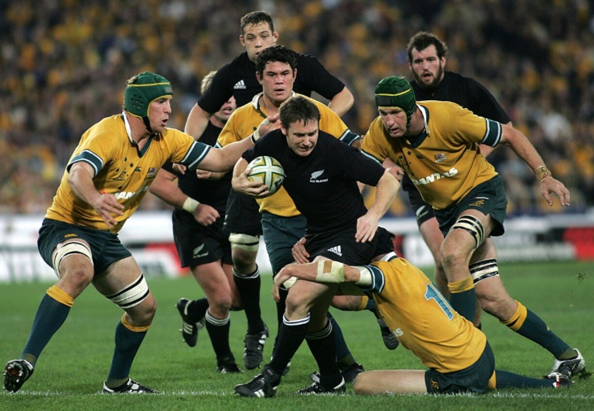 Andrew Mehrtens (C) played 70 times for New Zealand