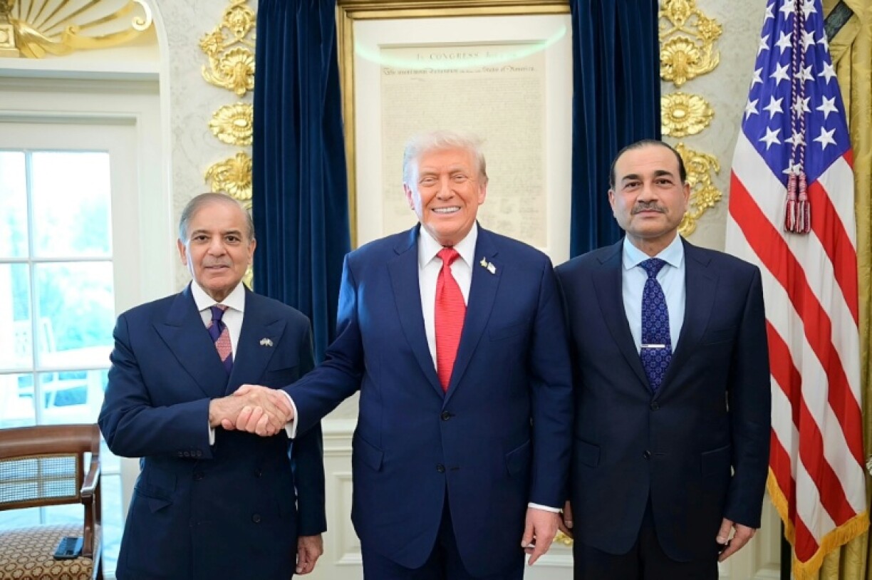 Asim Munir, right, with Sharif and US President Donald Trump at the White House in September