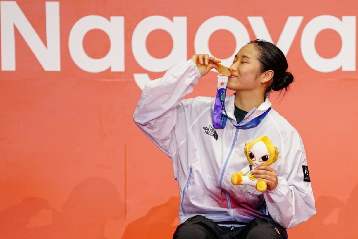 Gold medallist An Se-young celebrates on the podium