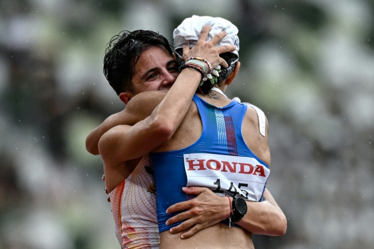 Spain's Maria Perez (L) hugs Italy's Antonella Palmisano