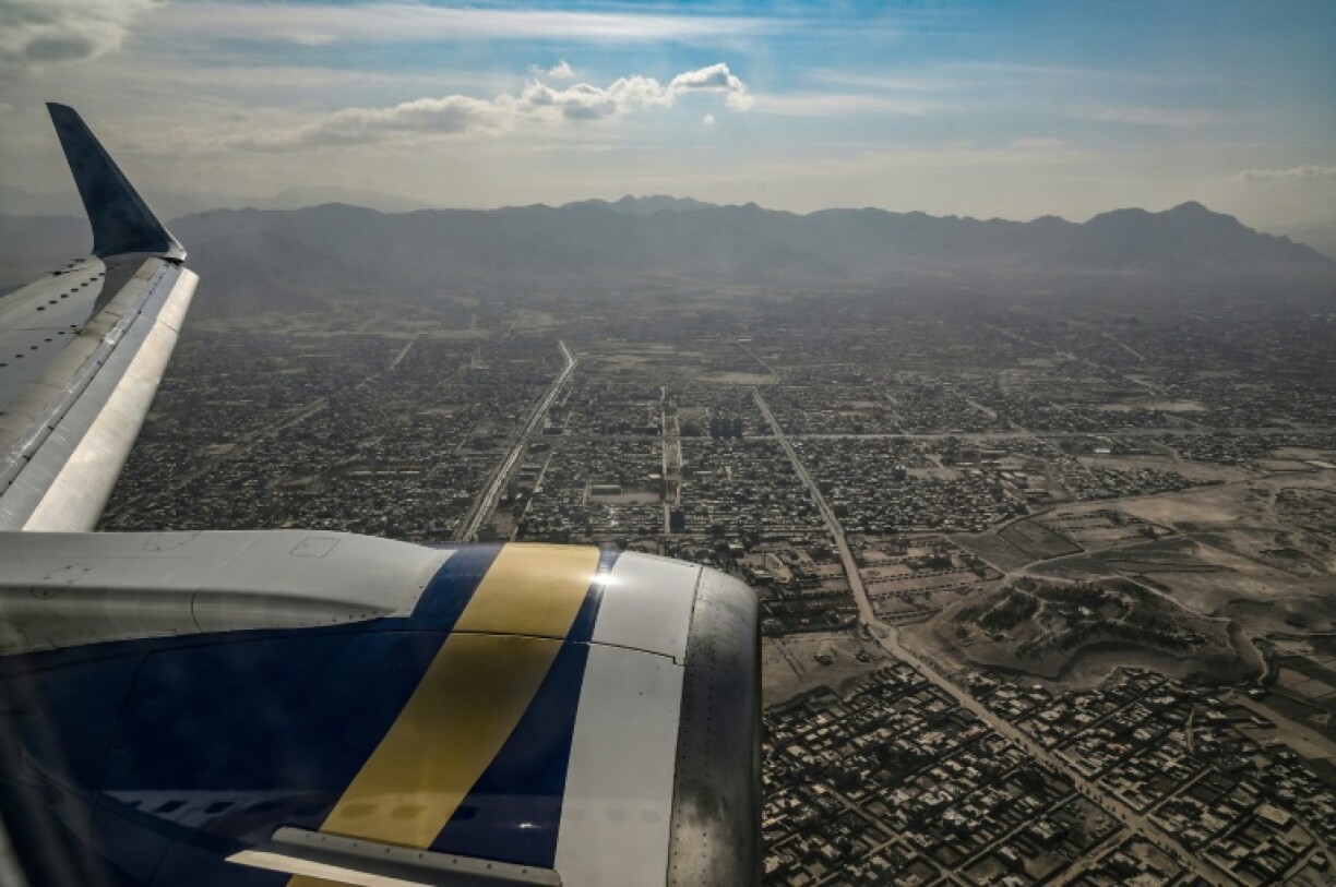 A view from inside a commercial plane flying over Kabul city in November 2021, after the Taliban takeover in August of that year