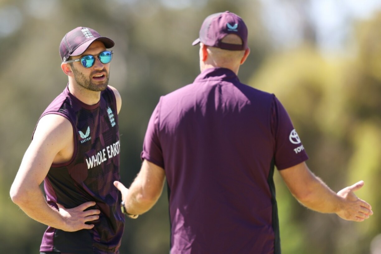 England's Mark Wood (L) bowled in the nets ahead of the first Test against Australia