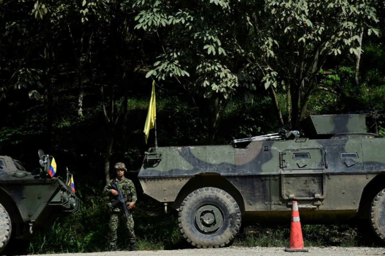 An Army soldier stands guard on a road as forces patrol in Tibu, Norte de Santander province, Colombia, on January 21, 2025, after recent clashes between rival left-wing guerrillas.