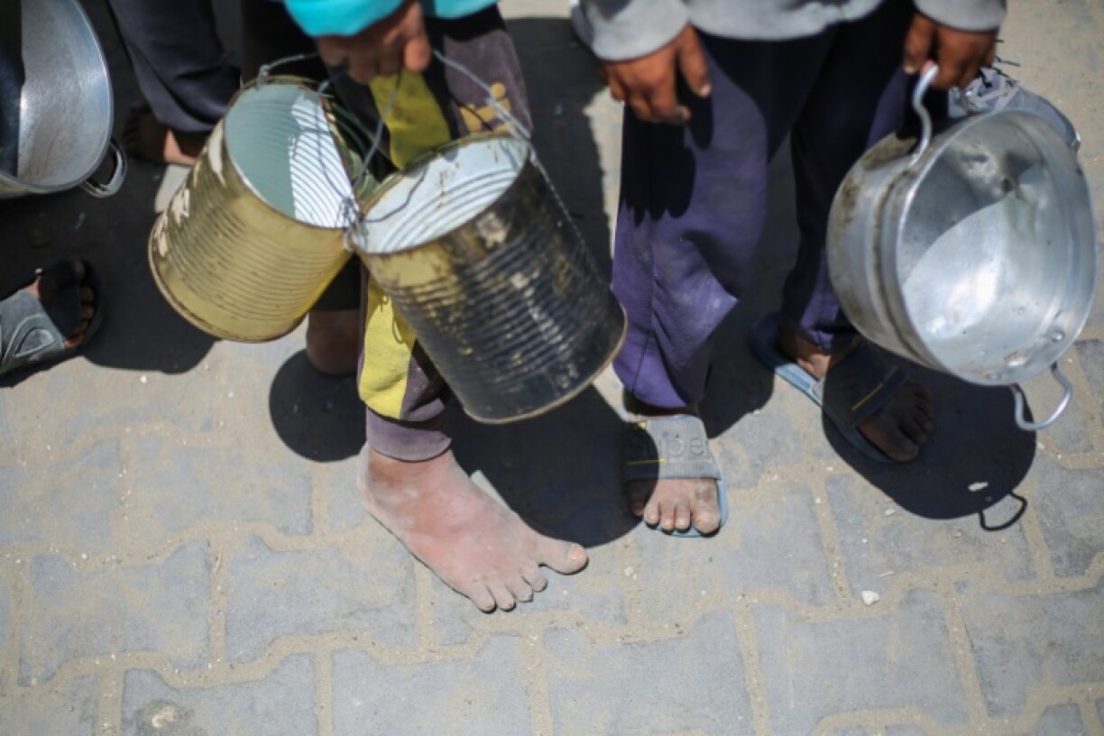 Thousands of Gazan children queue every day at community kitchens in the hope of securing food for their families