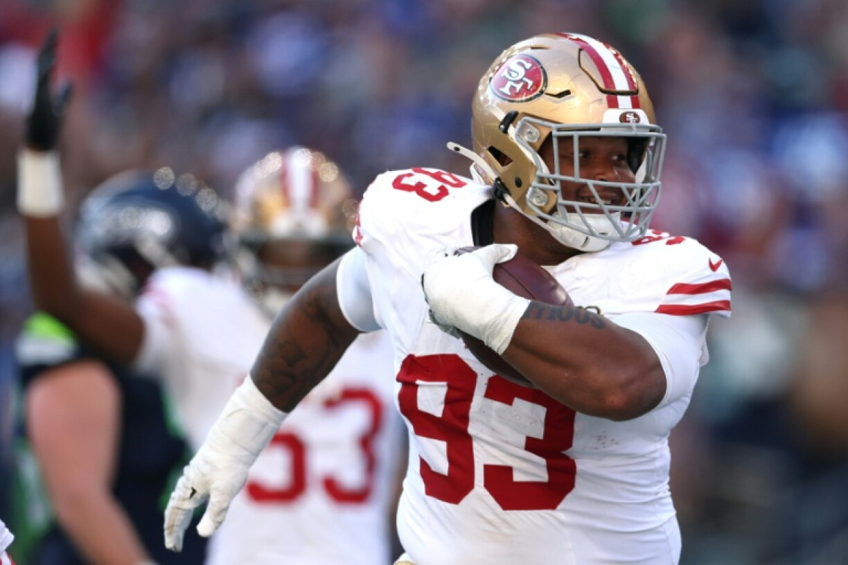 San Francisco's Gracen Halton celebrates a fumble recovery touchdown as defenders dominated in the 49ers' NFL victory at Seattle