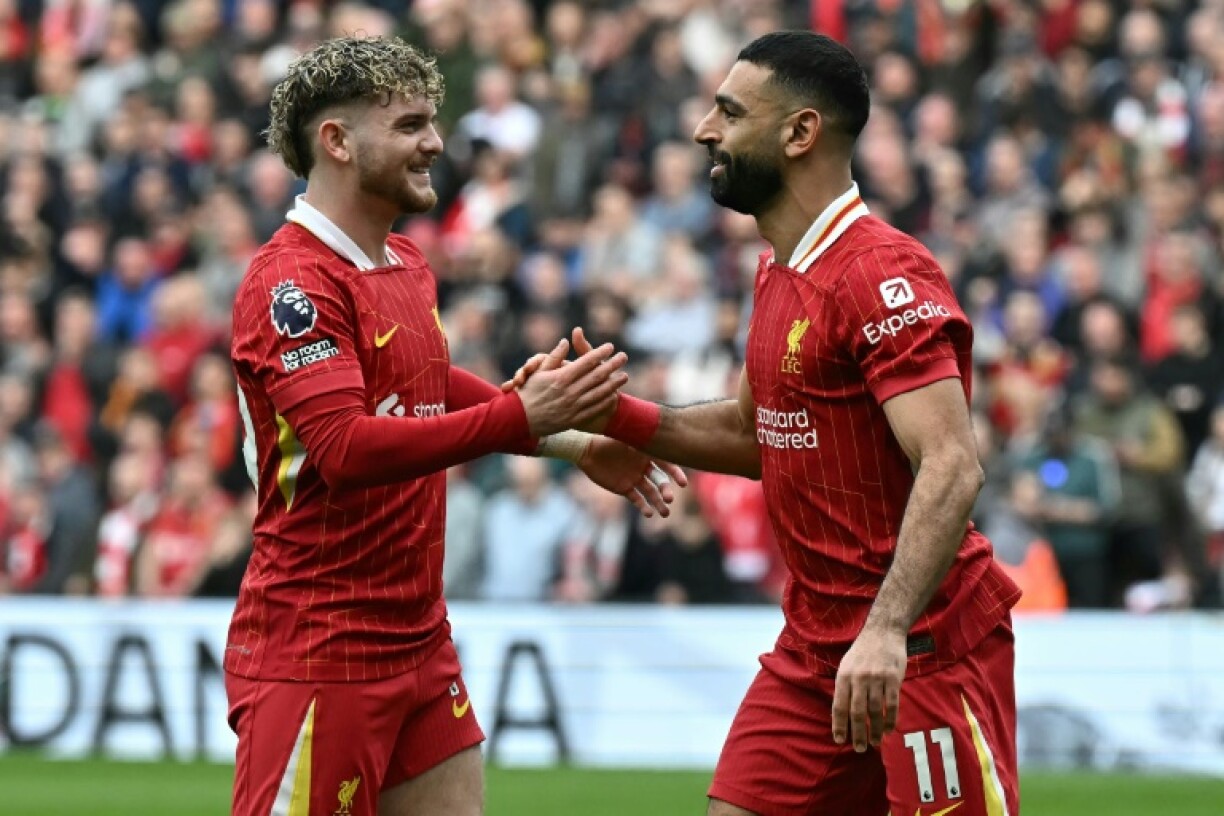 Mohamed Salah (R) and Harvey Elliott celebrate during Liverpool's win against Southampton