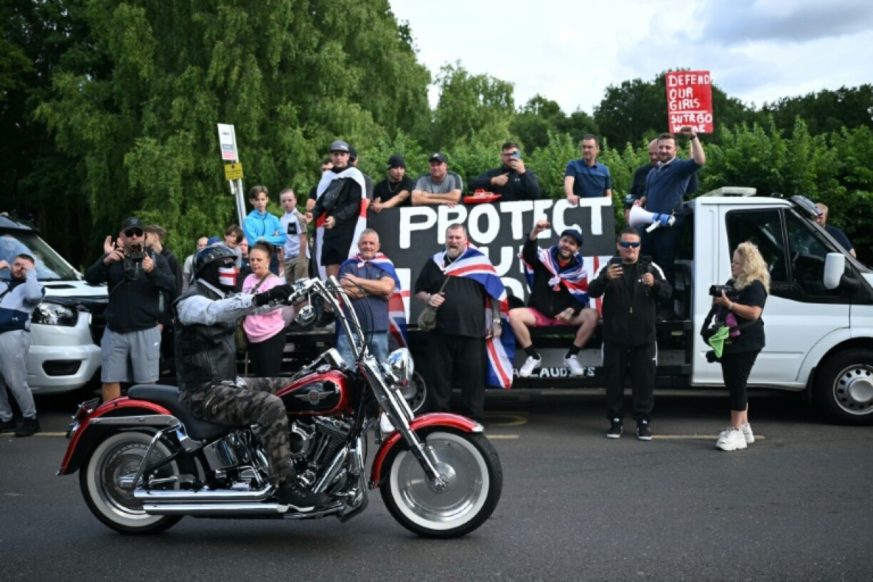 Anti-immigration protesters are seen outside The Bell Hotel, believed to be housing asylum seekers, in Epping, northeast of London on July 20, 2025