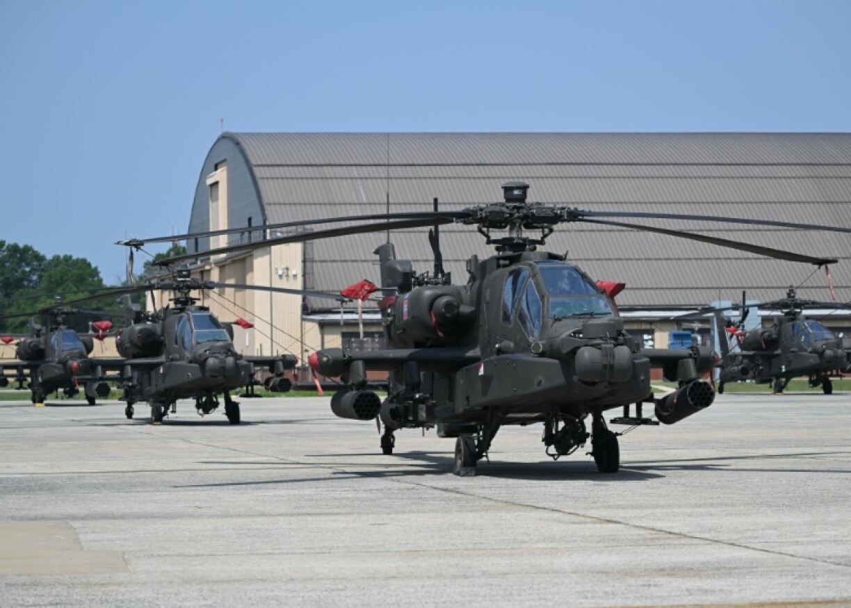 AH-64 Apache helicopters are displayed ahead of this weekend's celebration of the US Army's 250th anniversary, at Joint Base Andrews, Maryland, on June 12, 2025