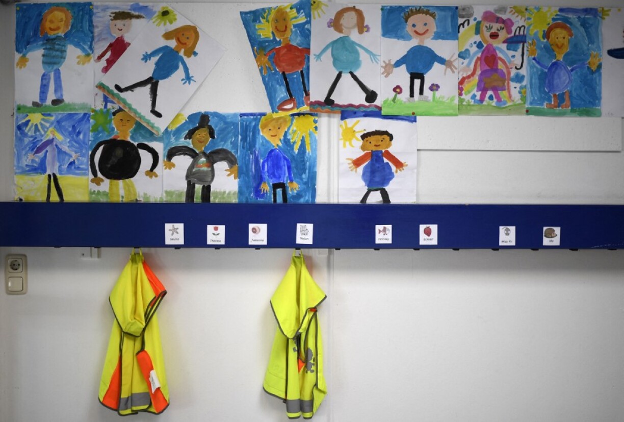 Drawings are seen above a wardrobe for pupils during a summer project at the primary school 'Sonnenschule' in Beckum, western Germany, on July 6, 2021. North-Rhine Westphalia's Minister of Education and Schools visits projects that have received funding from the state programme