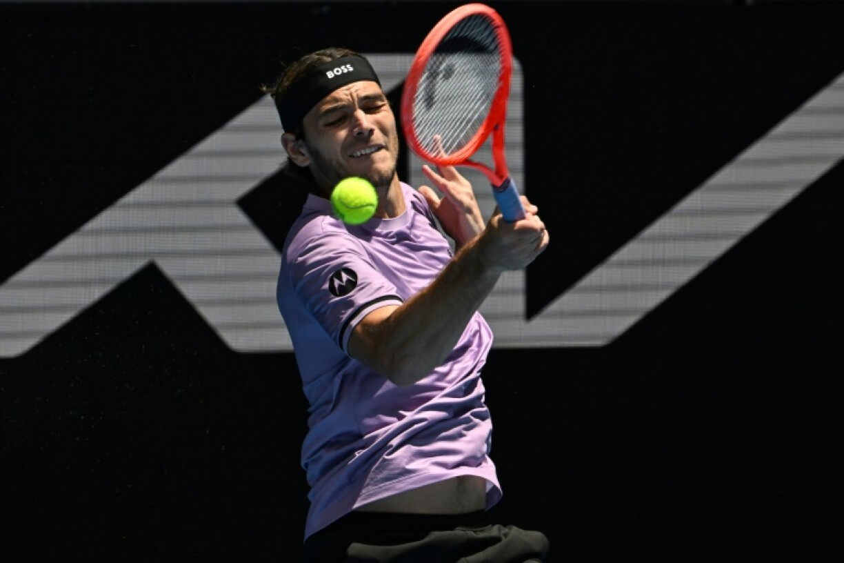 Taylor Fritz hits a return during his emphatic win against Chile's Cristian Garin at the Australian Open