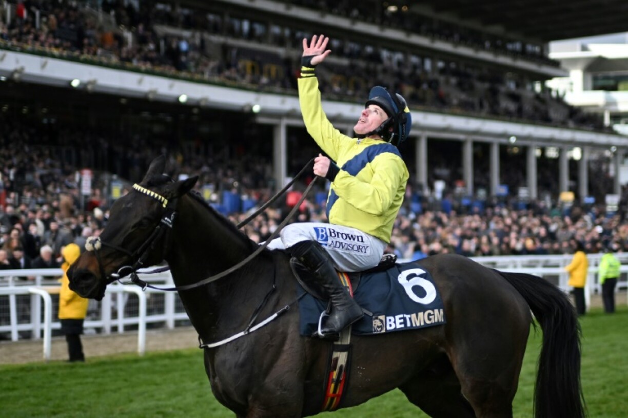 Sean Flanagan looks to the sky in tribute to his late friend and colleague Michael O'Sullivan after he won the Queen Mother Champion Chase at Cheltenham on Marine Nationale