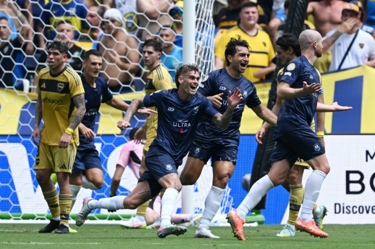 Auckland City defender Christian Gray (right) celebrates scoring his team's first goal at the Club World Cup against Boca Juniors
