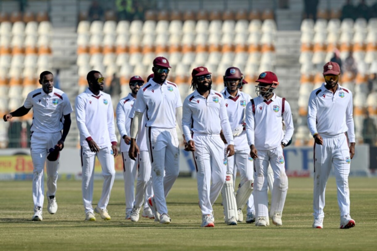 West Indies spin bowler Jomel Warrican and his team mates leave the ground after defeating Pakistan in the second cricket Test in Multan