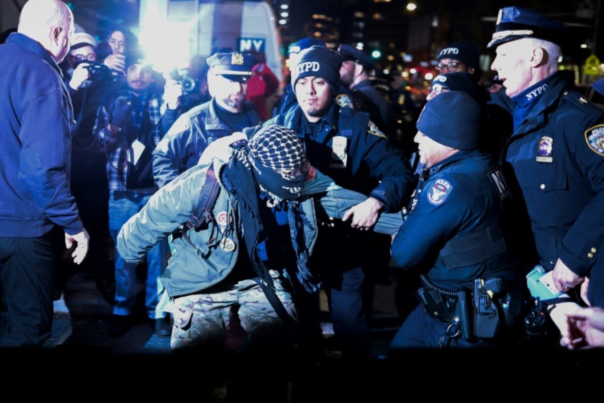 New York police officers arrest a protester during a demonstration to defend the rights of trans people, after President Donald Trump's executive order to restrict gender transition procedures for people under age 19