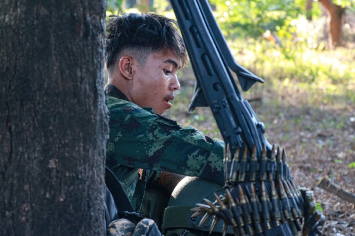In Moe Bye, on the border of Karen State and southern Shan State, a member of the KNA rests before returning to the front line