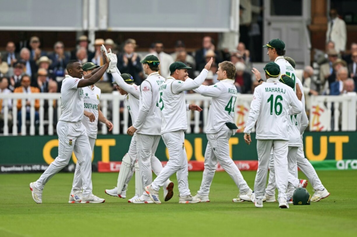 South Africa's Kagiso Rabada (L) celebrates with team-mates after dismissing Australia's Cameron Green in the WTC final at Lord's